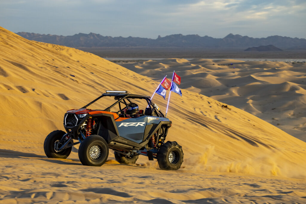 On assignment with La Revista Mujer, Danielle Becker enjoys a drive out into the dunes of Glamis, California, in a Polaris RZR Pro S Ultimate at the 2024 CampRZR gathering.