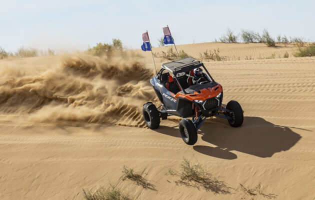 Danielle Becker drives the Polaris RZR Pro lineup while attending CampRZR in Glamis, California.