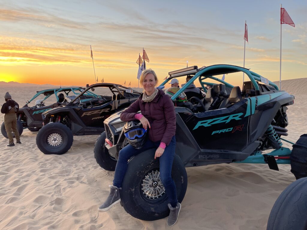 Polaris RZR vehicles and CampRZR are the perfect entrée to step into the driver’s seat, to explore the dunes, and to let go of life’s usual restrictions. Here Danielle Becker takes in the sunrise over the dunes of Glamis, California on the first ride of the day.